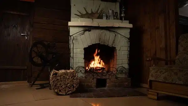 5 Places to Read Peacefully Other than Your Bed (Image 4) A Comfortable Chair by a Fire Place