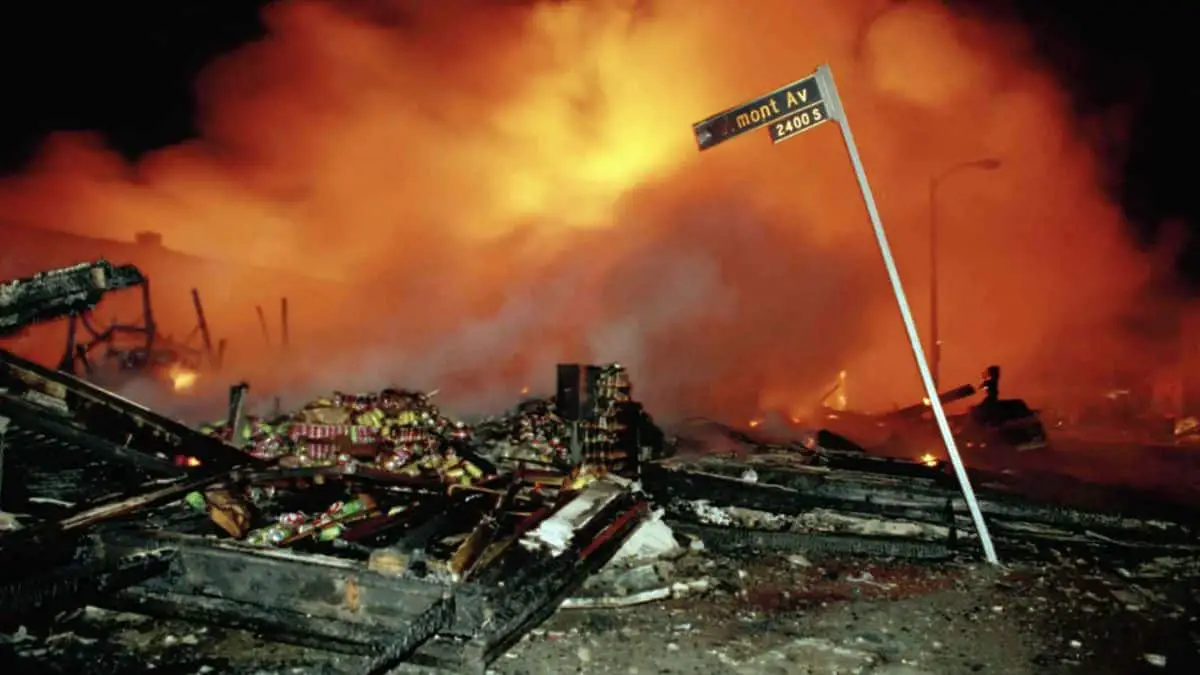 Major Historical Events on April 29 - Intense fire engulfs debris on city street at night.